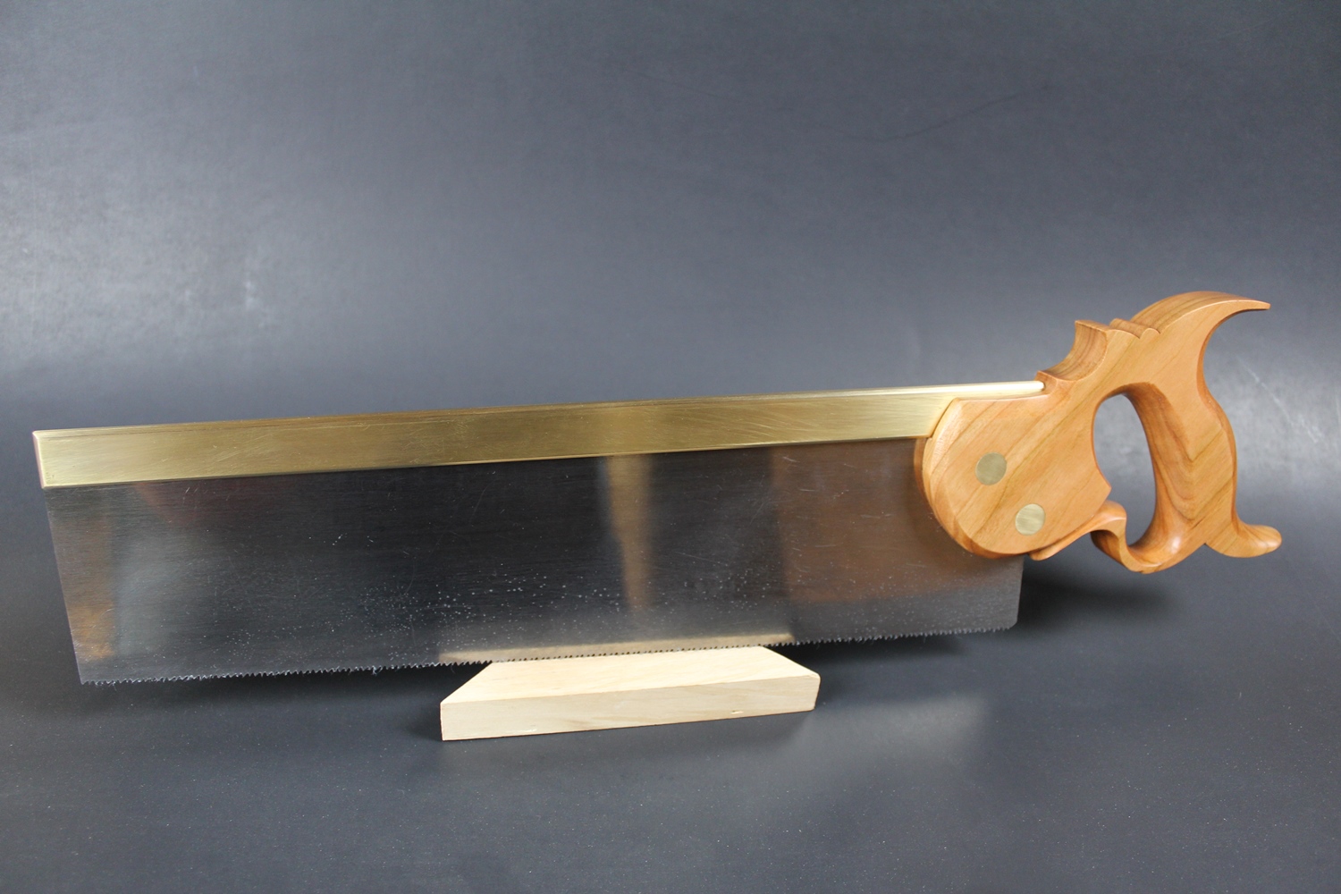 The blade is 14" long and 13 PPI, filed crosscut. The milled brass back came from Blackburn Tools, the saw bolts came from TGIAG. The saw blade was custom cut and filed by me.